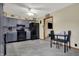 Modern kitchen with sleek black appliances, gray cabinets, and bright lighting fixtures at 318 Winfield St, Greenfield, IN 46140
