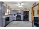 Updated kitchen featuring gray cabinets, stainless steel appliances, and stylish tile backsplash at 318 Winfield St, Greenfield, IN 46140