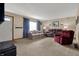 Cozy living room featuring comfortable seating, plush carpeting, and bright natural light at 318 Winfield St, Greenfield, IN 46140