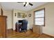 Home office with hardwood floors, a window and a ceiling fan at 318 Winfield St, Greenfield, IN 46140