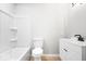 Clean bathroom with a neutral palette, simple fixtures, and essential amenities in a functional space at 322 S Boehning St, Indianapolis, IN 46219