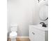 Clean bathroom featuring essential fixtures, neutral walls, and a well-lit vanity area at 322 S Boehning St, Indianapolis, IN 46219