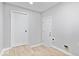 Clean and organized laundry room with essential hookups and ample space for laundry tasks at 322 S Boehning St, Indianapolis, IN 46219