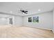 Open-concept living room featuring new flooring and multiple windows for ample natural light at 322 S Boehning St, Indianapolis, IN 46219