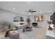 Bright living room featuring modern decorations, a plush sofa, and large windows for ample natural light at 322 S Boehning St, Indianapolis, IN 46219