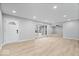 Bright open floor plan showcasing vinyl flooring, neutral walls, and seamless integration with the foyer at 322 S Boehning St, Indianapolis, IN 46219