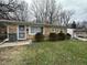 Charming single-story home featuring a stone facade and a well-maintained front yard at 3317 Adams St, Indianapolis, IN 46218