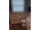 Compact bathroom features standard toilet, sink, and window at 351 N Smart St, Greenwood, IN 46142