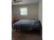 A cozy bedroom with a neutral palette, carpet flooring, and a window allowing natural light at 351 N Smart St, Greenwood, IN 46142