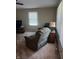 Spacious living room featuring a ceiling fan, carpet and natural light at 351 N Smart St, Greenwood, IN 46142