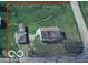 Aerial view of the property showcasing its layout, including the house, sheds, and expansive yard at 359 N Whitcomb Ave, Indianapolis, IN 46224