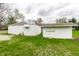 Well-kept backyard featuring two white storage sheds and lush green lawn at 359 N Whitcomb Ave, Indianapolis, IN 46224