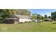 Spacious backyard featuring a well-maintained lawn, a detached garage, and a charming single-Gathering home at 359 N Whitcomb Ave, Indianapolis, IN 46224