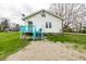 Charming home featuring a bright blue deck and stairs, with classic white siding and well-maintained landscaping at 359 N Whitcomb Ave, Indianapolis, IN 46224