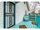 Inviting front porch featuring a secure entrance, bright decor, and cozy seating area at 359 N Whitcomb Ave, Indianapolis, IN 46224