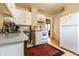 Functional kitchen featuring bright cabinets, classic appliances, and vintage charm at 359 N Whitcomb Ave, Indianapolis, IN 46224