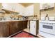 Functional kitchen featuring bright cabinets, a classic stove, and vintage decor at 359 N Whitcomb Ave, Indianapolis, IN 46224