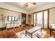 Open living area with original hardwood floors, vintage trim, and vintage lighting at 359 N Whitcomb Ave, Indianapolis, IN 46224