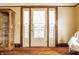 Bright living room with beautiful hardwood floors and unique cabinet with glass doors at 359 N Whitcomb Ave, Indianapolis, IN 46224