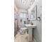 Cozy bathroom with pedestal sink, farmhouse style shower curtain, and classic fixtures at 3638 Redfern Dr, Indianapolis, IN 46237