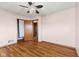 Bedroom featuring hardwood floors, closet, and open doorway to the next room at 3638 Redfern Dr, Indianapolis, IN 46237