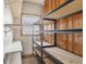 Organized pantry with metal shelving for ample storage and a window for natural light at 3638 Redfern Dr, Indianapolis, IN 46237