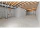 Spacious unfinished basement featuring concrete floor and walls, plus utilities at 401 Iowa St, Indianapolis, IN 46225