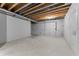 Unfinished basement with concrete floors, exposed ceiling, and concrete walls at 401 Iowa St, Indianapolis, IN 46225