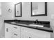 Bathroom featuring a granite countertop and double sinks, offering a modern and functional space at 401 Iowa St, Indianapolis, IN 46225