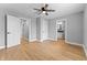 Main bedroom featuring hardwood floors and multiple doorways and access to bathroom at 401 Iowa St, Indianapolis, IN 46225