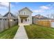 Charming two-story home with a front porch and a well-manicured lawn at 401 Iowa St, Indianapolis, IN 46225