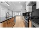 Open-concept kitchen with a central island, wooden floors, and sleek appliances at 401 Iowa St, Indianapolis, IN 46225