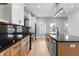 Modern kitchen with an island, stainless steel appliances, and stylish light fixture at 401 Iowa St, Indianapolis, IN 46225