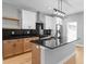Bright kitchen with stainless steel appliances, granite countertops, and a functional island at 401 Iowa St, Indianapolis, IN 46225