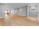 Open-concept living space with hardwood floors, recessed lighting, and an adjacent kitchen area at 401 Iowa St, Indianapolis, IN 46225