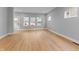 Bright living room featuring light hardwood floors and large windows, offering ample natural light at 401 Iowa St, Indianapolis, IN 46225