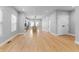Open-concept layout highlighting hardwood floors, neutral walls, and recessed lighting at 401 Iowa St, Indianapolis, IN 46225