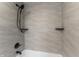 Modern bathroom features a shower with matte black fixtures, a handheld shower head, and tiled walls at 401 Iowa St, Indianapolis, IN 46225