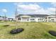 Spacious backyard with a well-manicured lawn, and a covered patio, perfect for outdoor entertaining and relaxation at 4179 Hume Ave, Plainfield, IN 46168