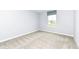 This bedroom features neutral carpeting, white walls and a window for natural light at 4179 Hume Ave, Plainfield, IN 46168