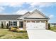 Charming home with stone accents, manicured lawn, and a two-car garage, blending curb appeal with functionality at 4179 Hume Ave, Plainfield, IN 46168