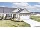 Charming home with stone accents, manicured lawn, and a two-car garage, blending curb appeal with functionality at 4179 Hume Ave, Plainfield, IN 46168
