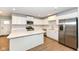 Modern kitchen with white cabinets, stainless steel appliances, and an island, perfect for cooking at 4179 Hume Ave, Plainfield, IN 46168