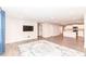Spacious living room with wood flooring, a modern rug, and an open layout at 4179 Hume Ave, Plainfield, IN 46168