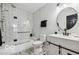 Modern bathroom with subway tile shower, patterned floor, and white vanity with a round mirror at 431 W Main St, Lizton, IN 46149