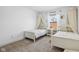 Charming bedroom with twin beds, natural light, and a serene ambiance at 431 W Main St, Lizton, IN 46149