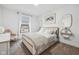Bright bedroom featuring stylish furnishings, a window view, and calming decor at 431 W Main St, Lizton, IN 46149