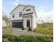 Charming two-story modern farmhouse exterior with a black garage door and landscaping at 431 W Main St, Lizton, IN 46149