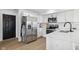 Well-lit kitchen featuring modern appliances, white cabinets, and subway tile backsplash at 431 W Main St, Lizton, IN 46149