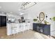Modern kitchen featuring stainless steel appliances, white cabinets, and a stylish breakfast bar with seating at 431 W Main St, Lizton, IN 46149